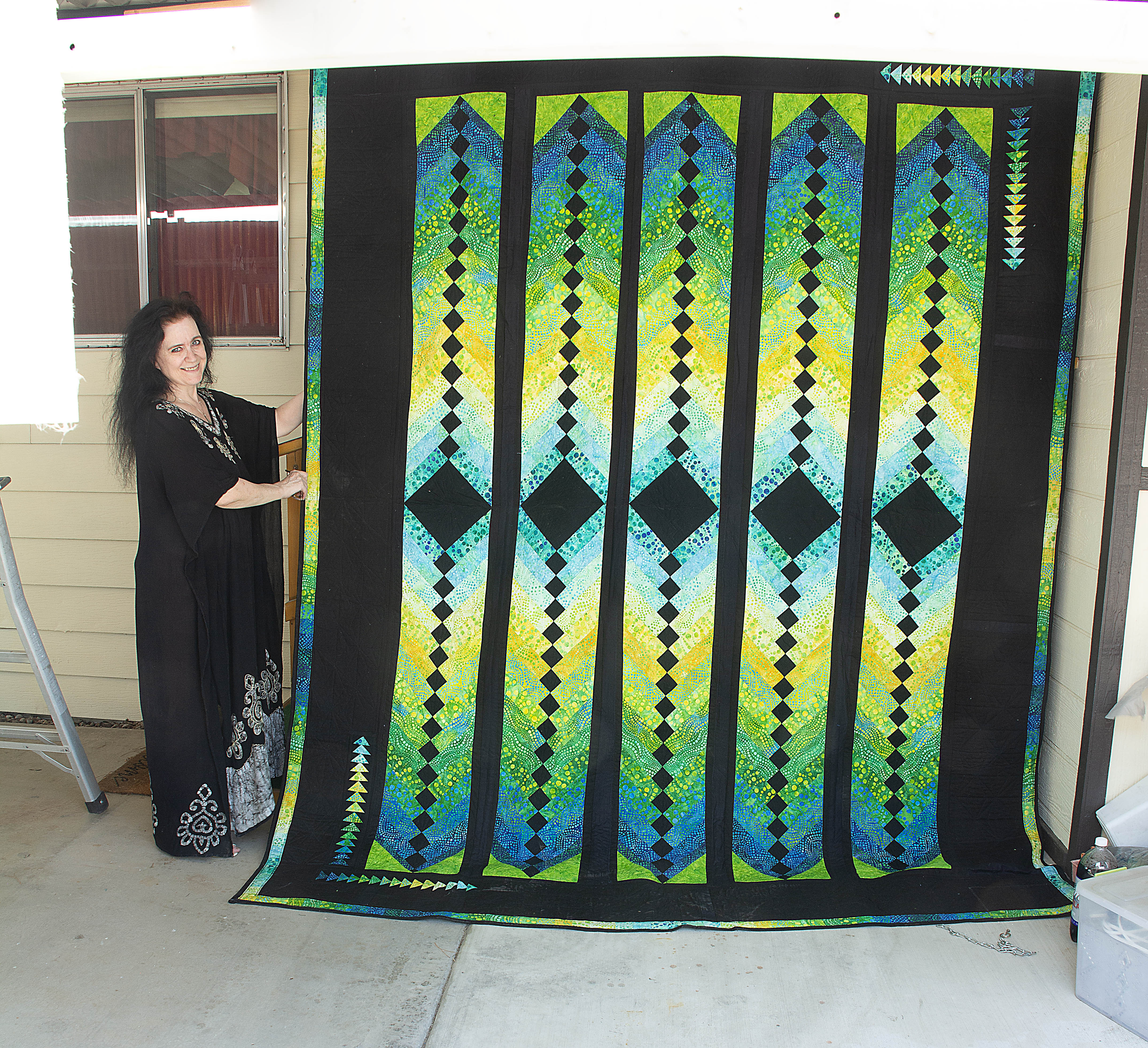 One All-Purpose French Braid Quilt in tones of Blue, Green and Yellow